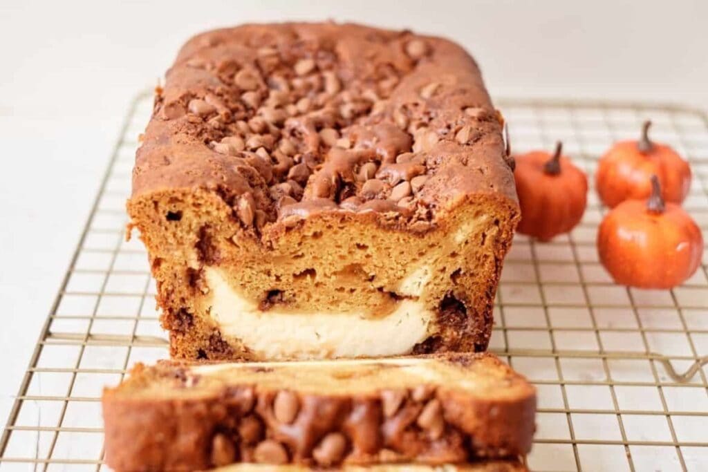 Pumpkin bread on a cooling rack.