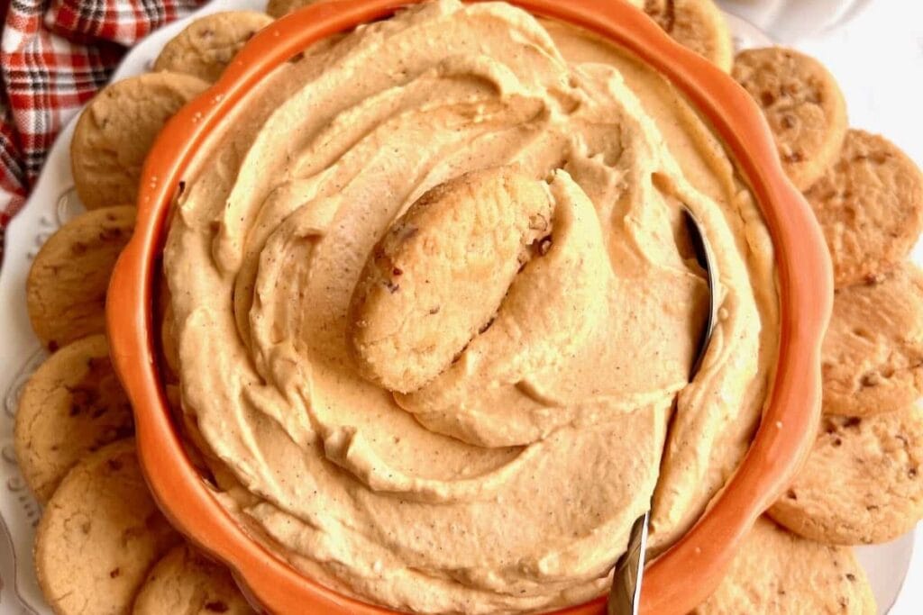 Pumpkin cream cheese dip with crackers.