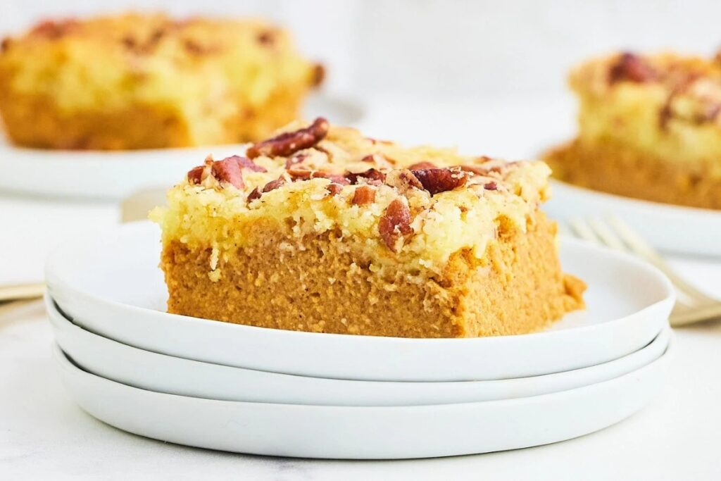 Pumpkin dump cake on a white plate.