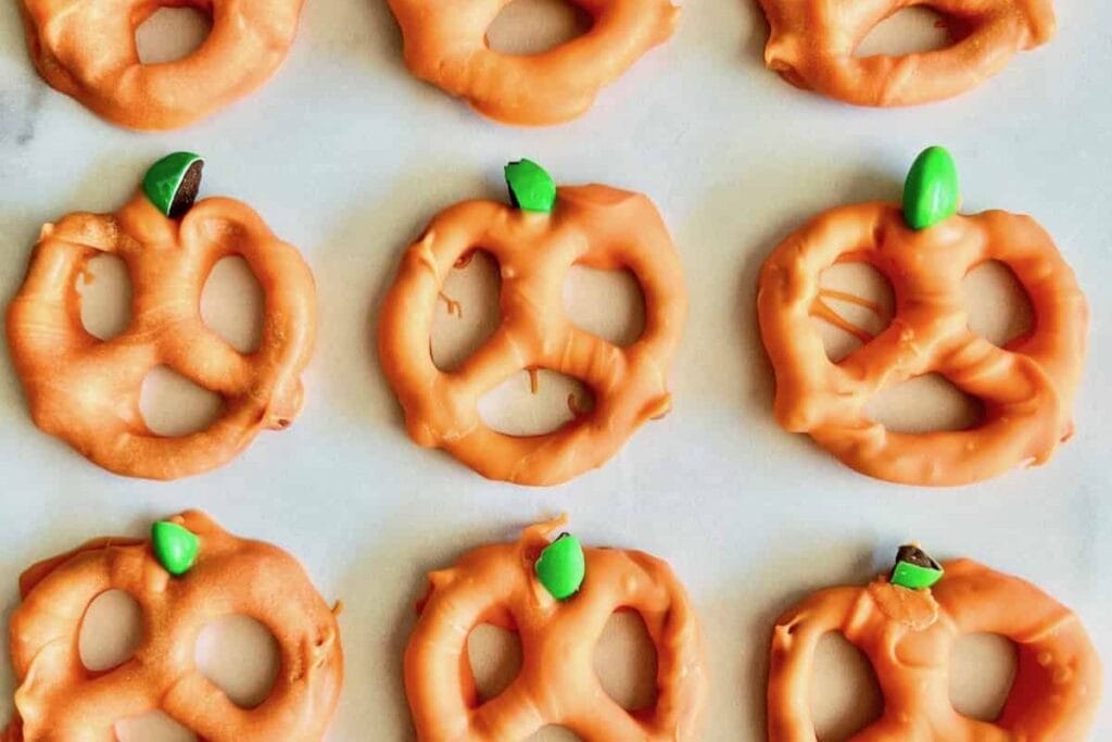 Pumpkin shaped pretzels on white background