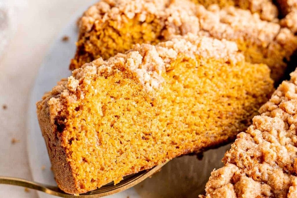 Pumpkin spice coffee cake slice lifted.
