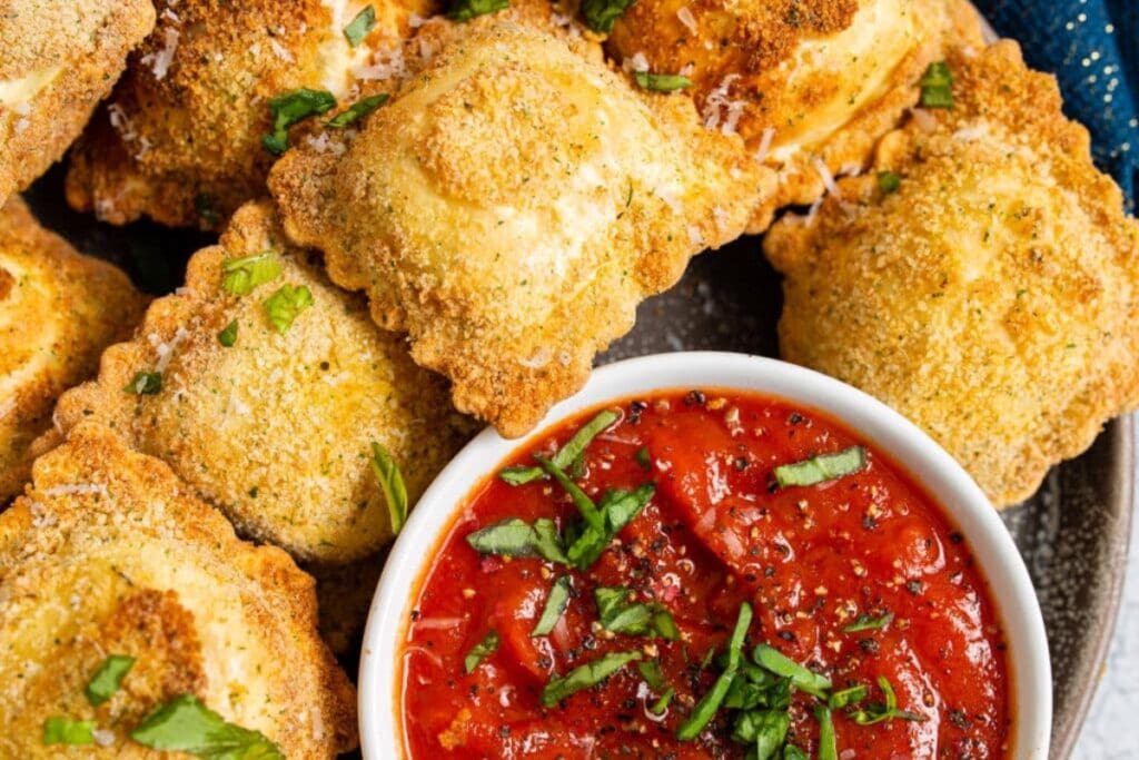 Ravioli with dipping sauce.