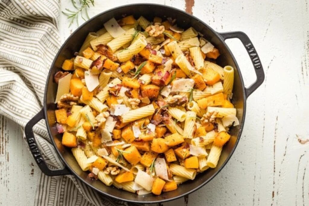 Roasted butternut squash pasta in a skillet.