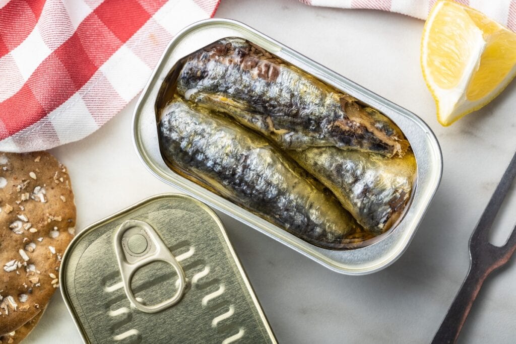 Sardines and crackers on a table.