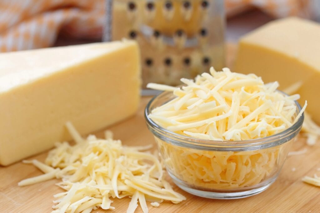 Shredded cheese in a bowl.