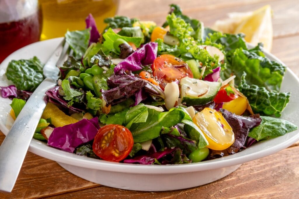 Side salad in a white bowl.