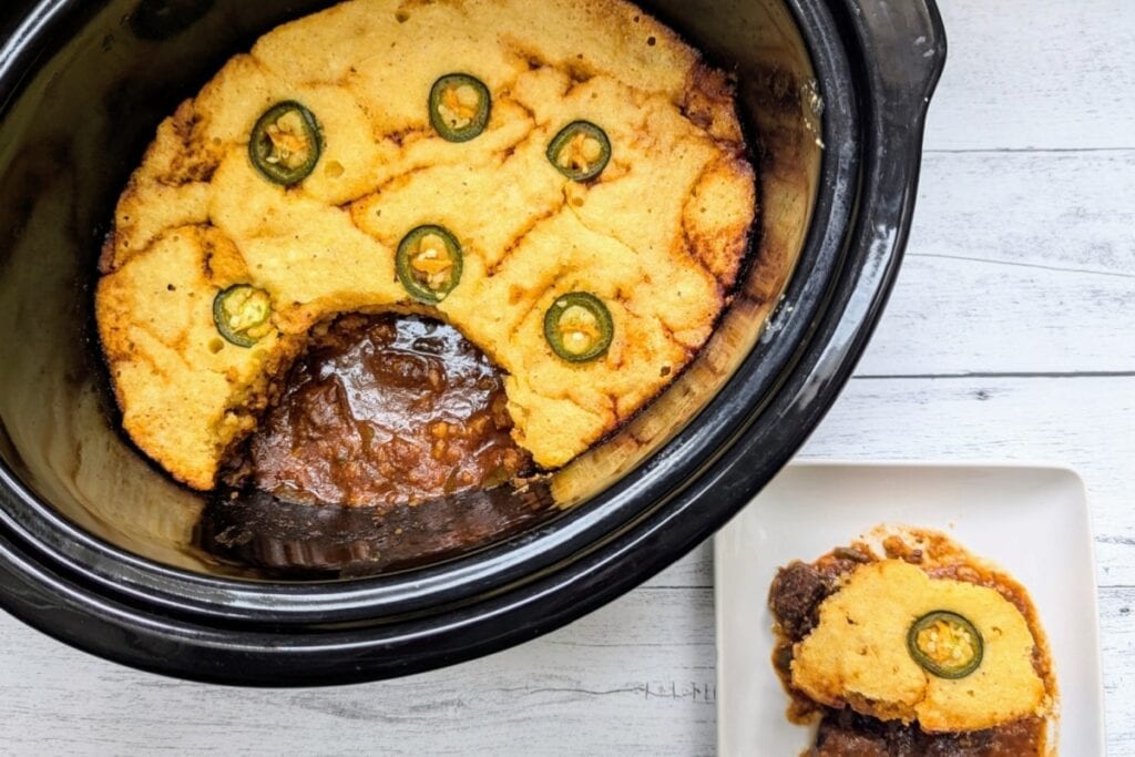 BBQ beef cornbread casserole cooked in a slow cooker.