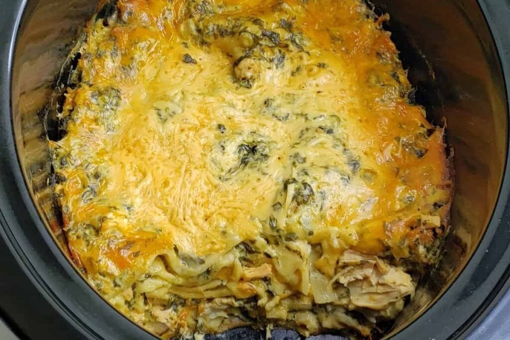 Chicken spinach lasagna cooked in a slow cooker.