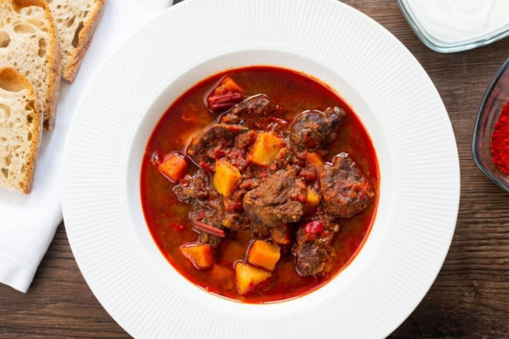 Slow Cooker Hungarian Goulash on a narrow white plate.
