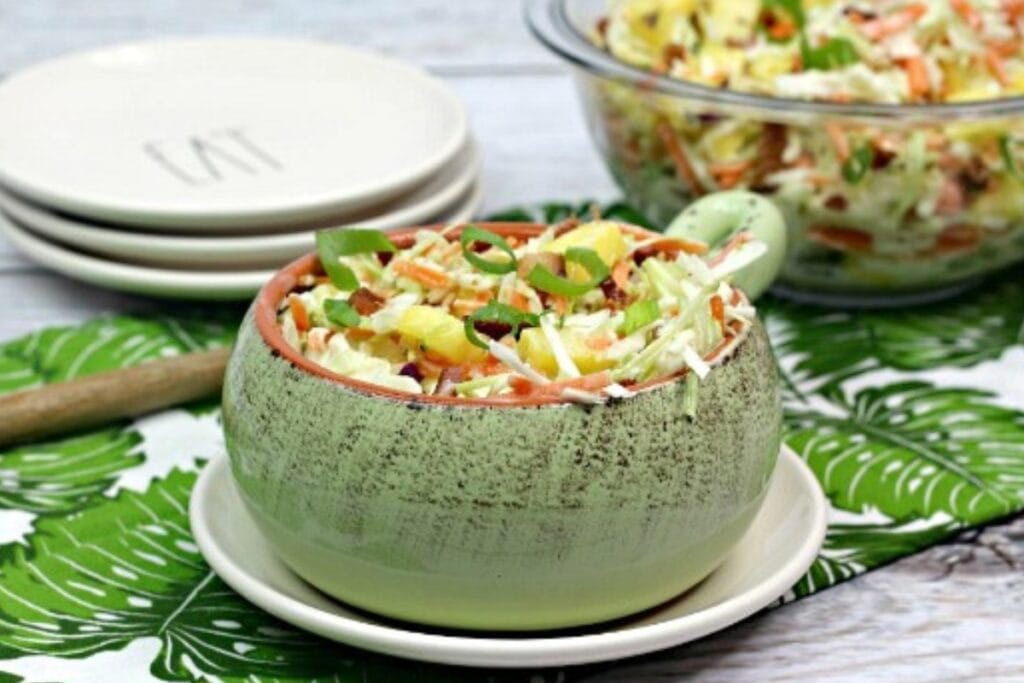Southern pineapple bacon coleslaw in a handled bowl.