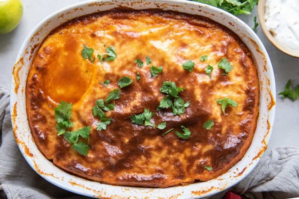 Tamale pie in an oval baking dish.