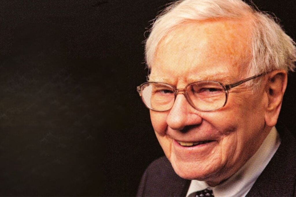Warren buffet with glasses on looking at camera.