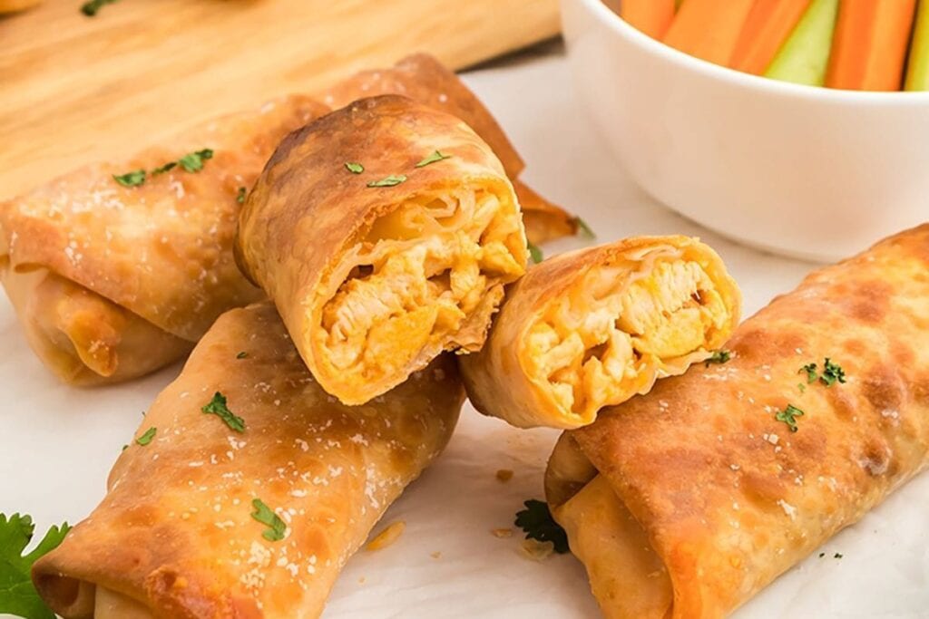 A close up shot of buffalo chicken egg rolls.