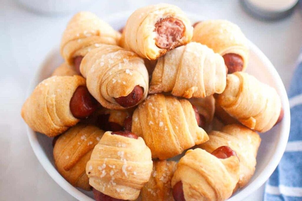A bowl of pigs in a blanket.