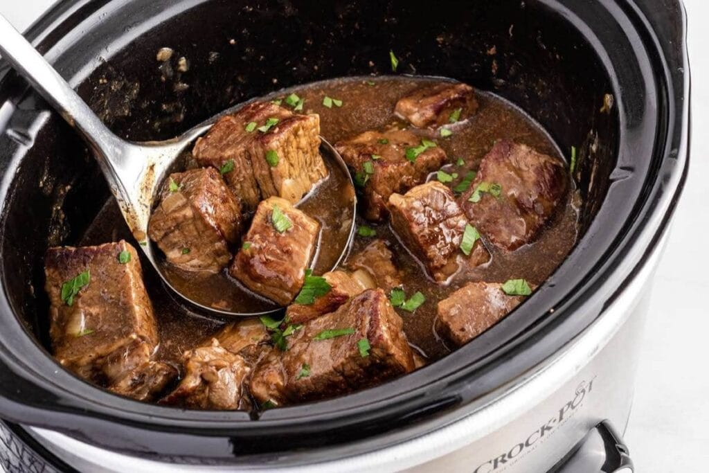 Beef tips in a slow cooker.