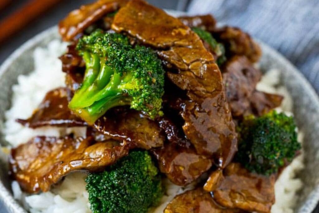 A close up shot of beef and broccoli.