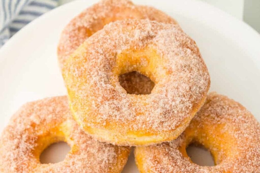A close up shot of biscuit donuts.