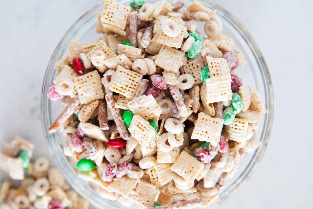 A close up shot of Christmas chex mix.
