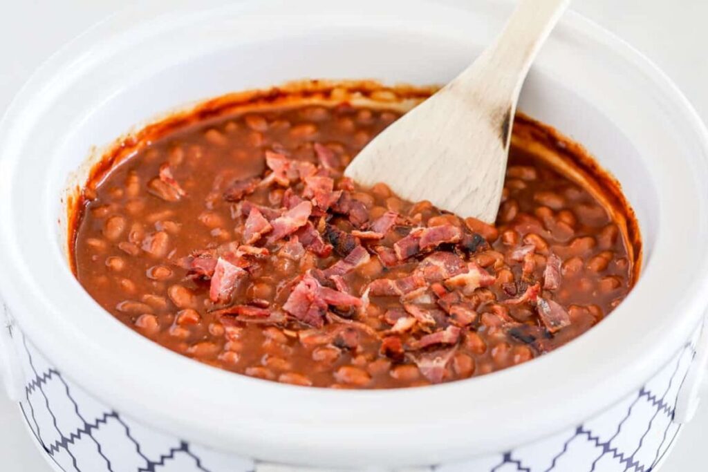 A close up shot of crockpot baked beans.