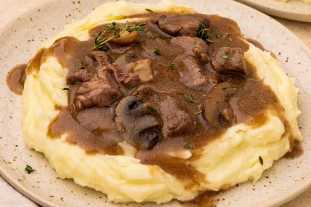 A close up shot of beef tips and gravy.
