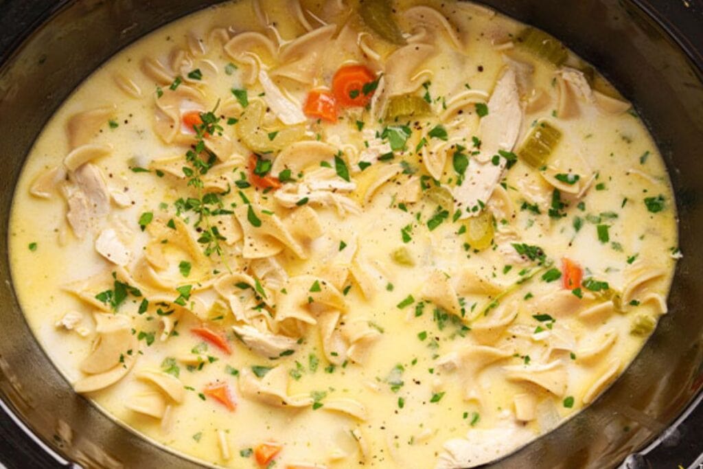 A close up shot of chicken noodle soup.