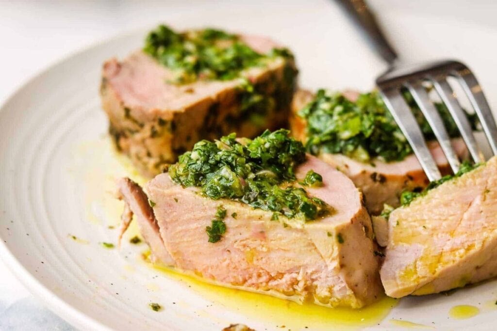 A close up shot of chimichurri pork tenderloin.