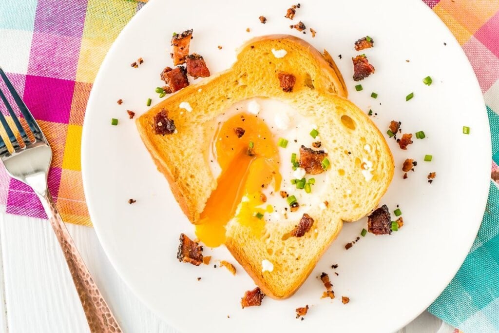 Sheet pan egg in a hole on a plate.