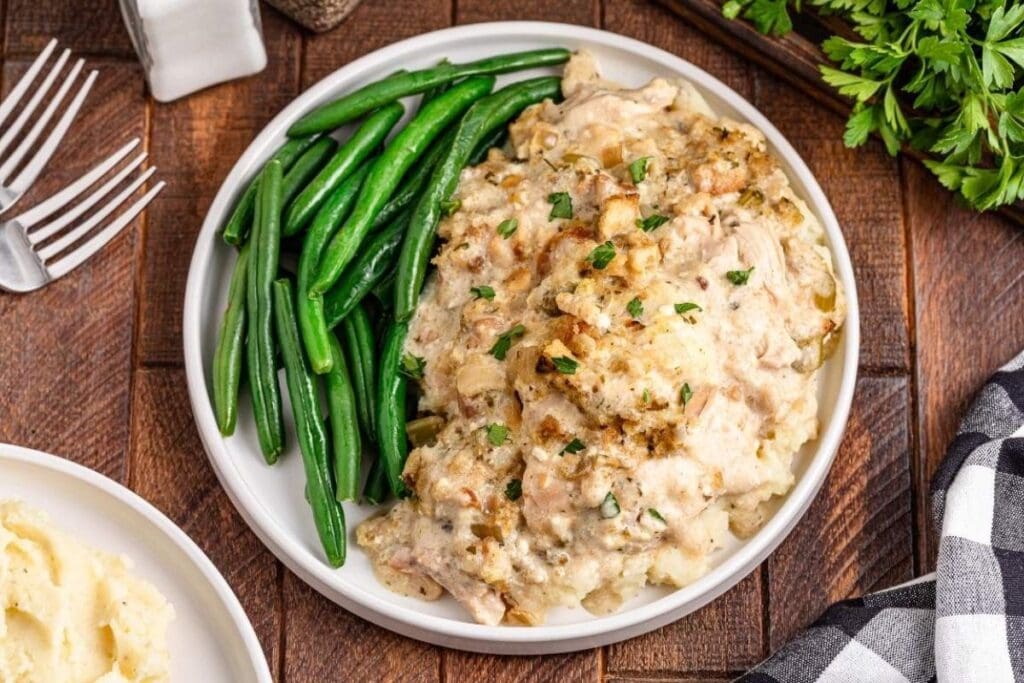 A close up shot of chicken and stuffing.