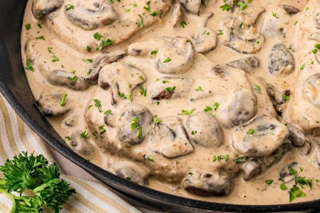 Pork chops with cream close up shot.