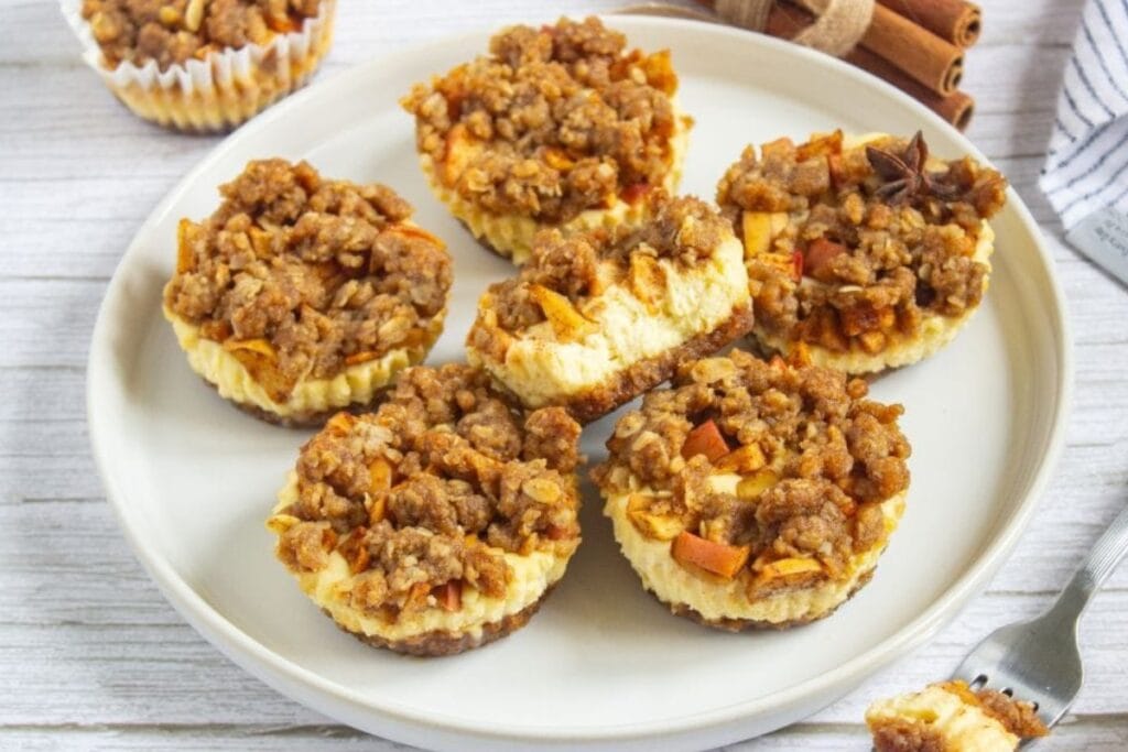 Apple Crisp Mini cheesecakes on a plate.