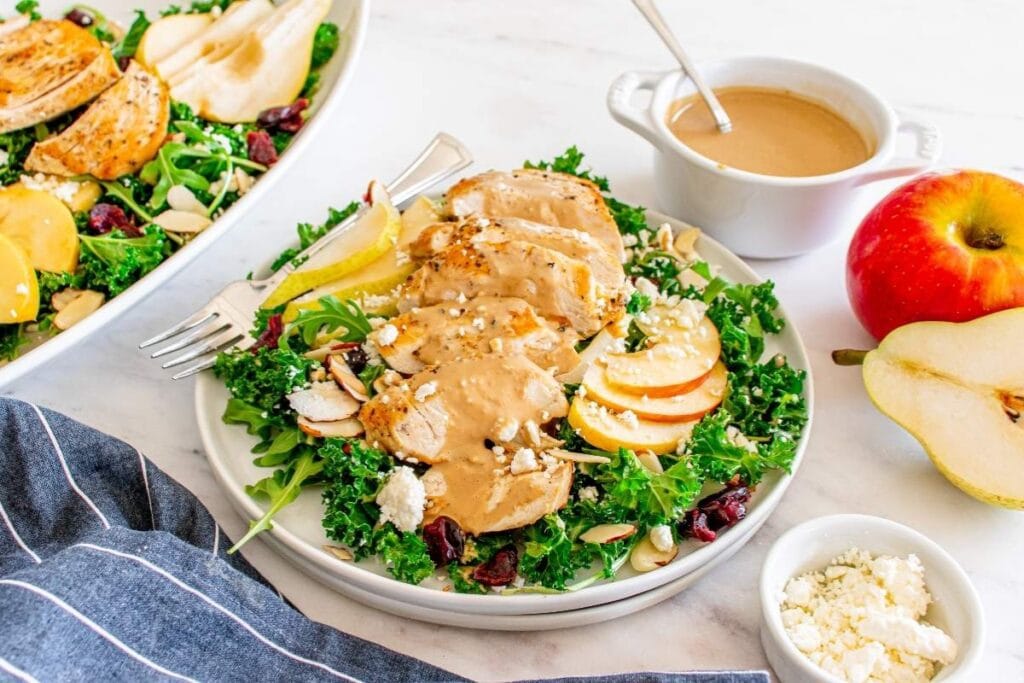 Autumn salad with chicken on a plate.