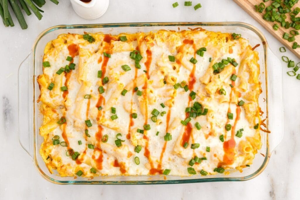 Buffalo chicken casserole in a glass baking dish.