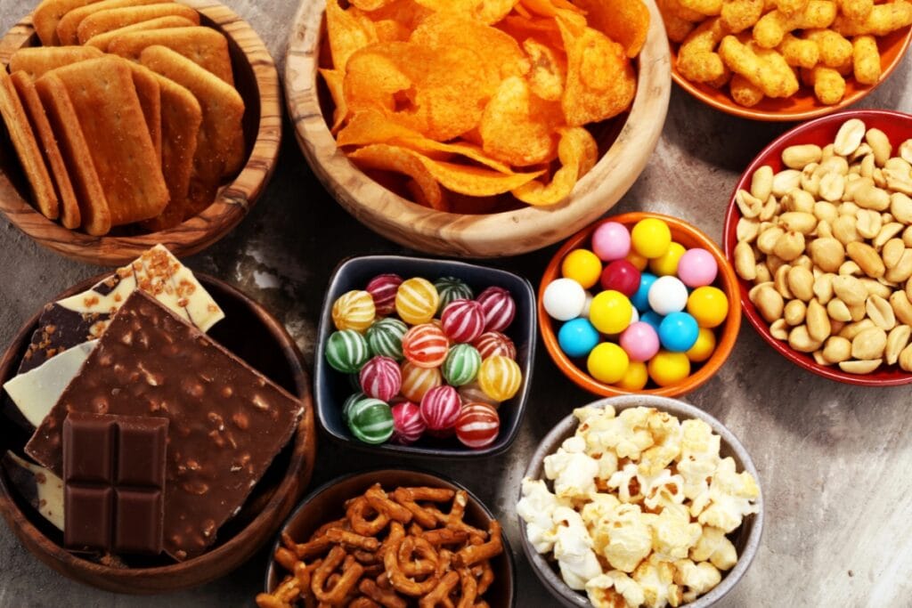 Assorted candy and snacks on a table.