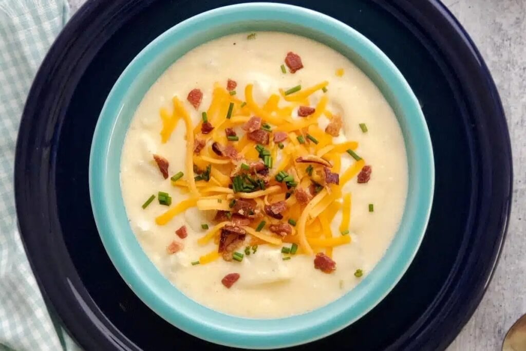 Bowl of cheesy potato soup.