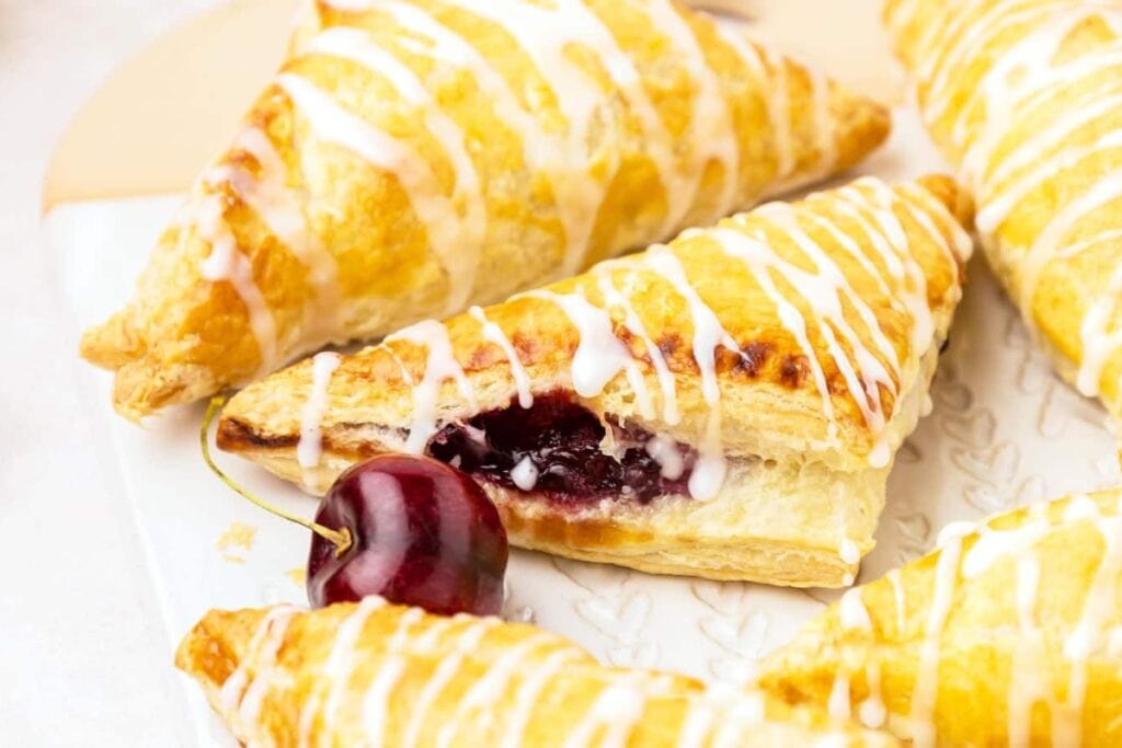 Cherry turnovers on a plate.
