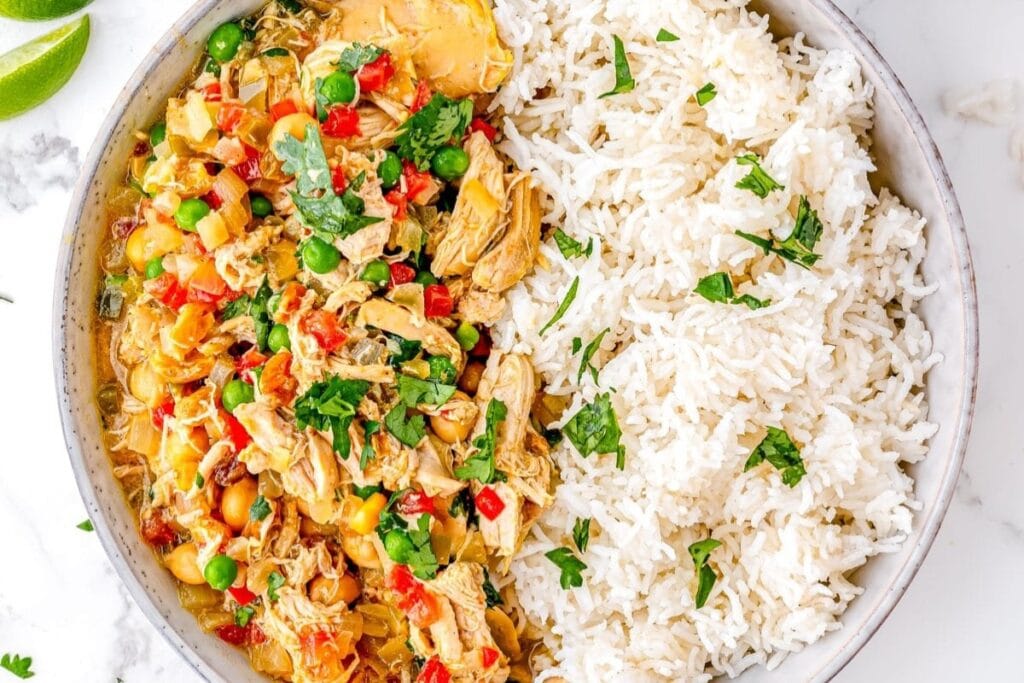 chicken curry with rice on a plate.