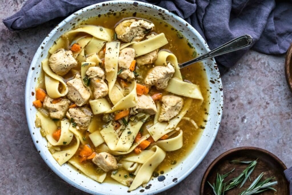 Chicken noodle soup in a bowl.