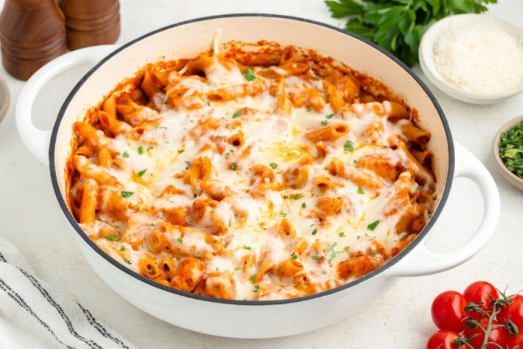 Chicken parmesan pasta in a handled baking dish.