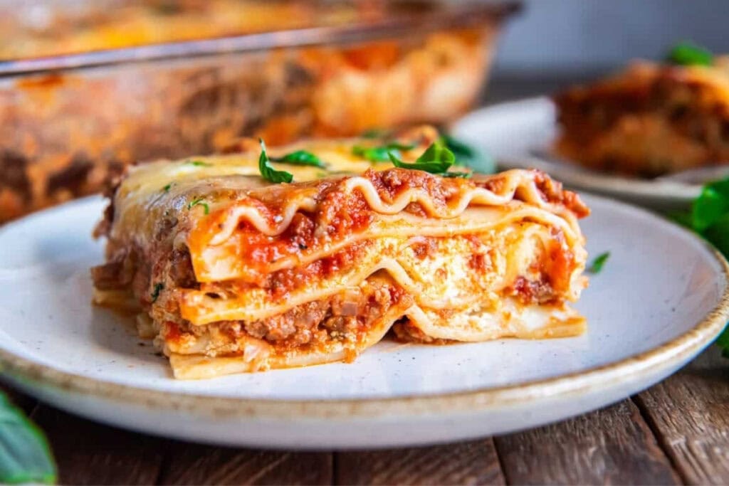 Classic lasagna on a white plate.