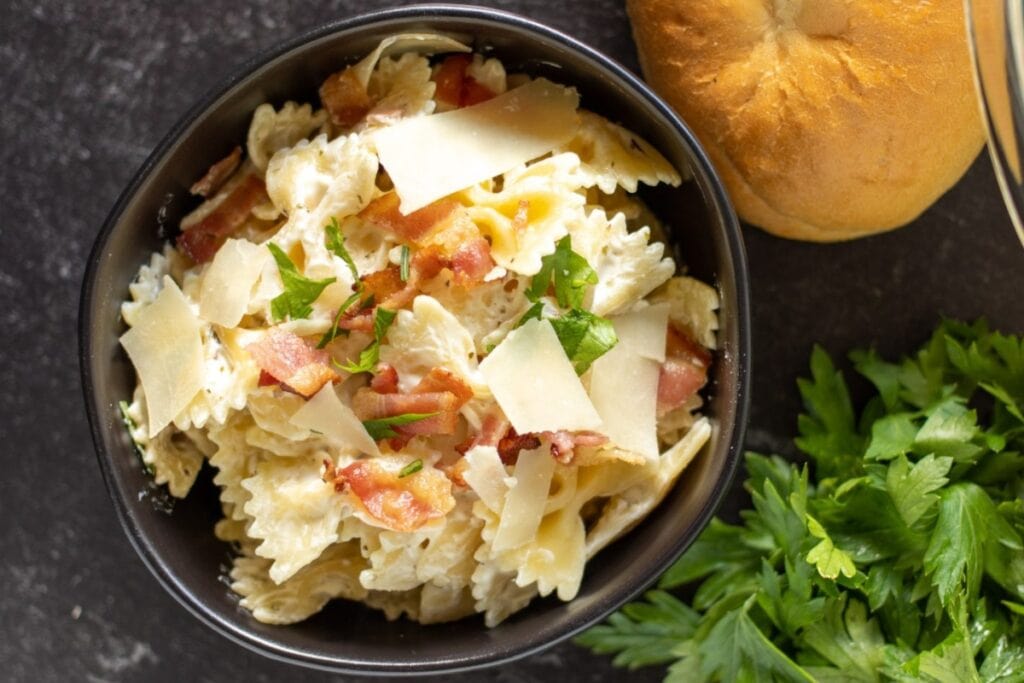 Creamy bow tie pasta in a bowl.
