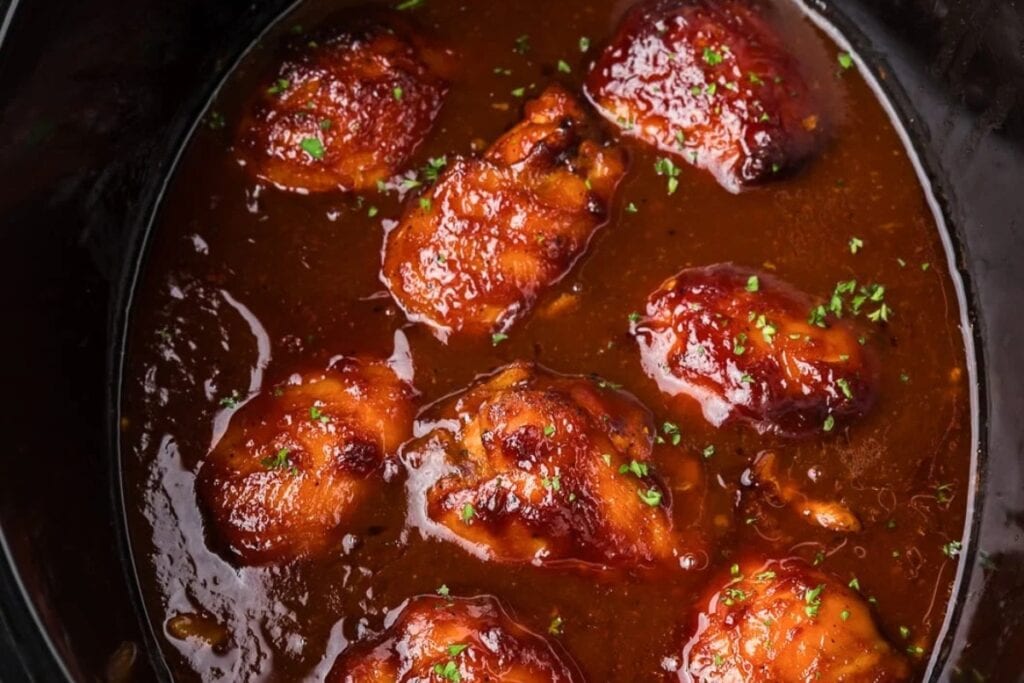 BBQ chicken thighs in a crockpot.