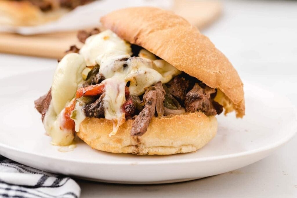 Crockpot Philly cheesesteak sandwich on a plate.