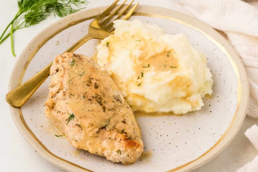 Dijon chicken on a plate.