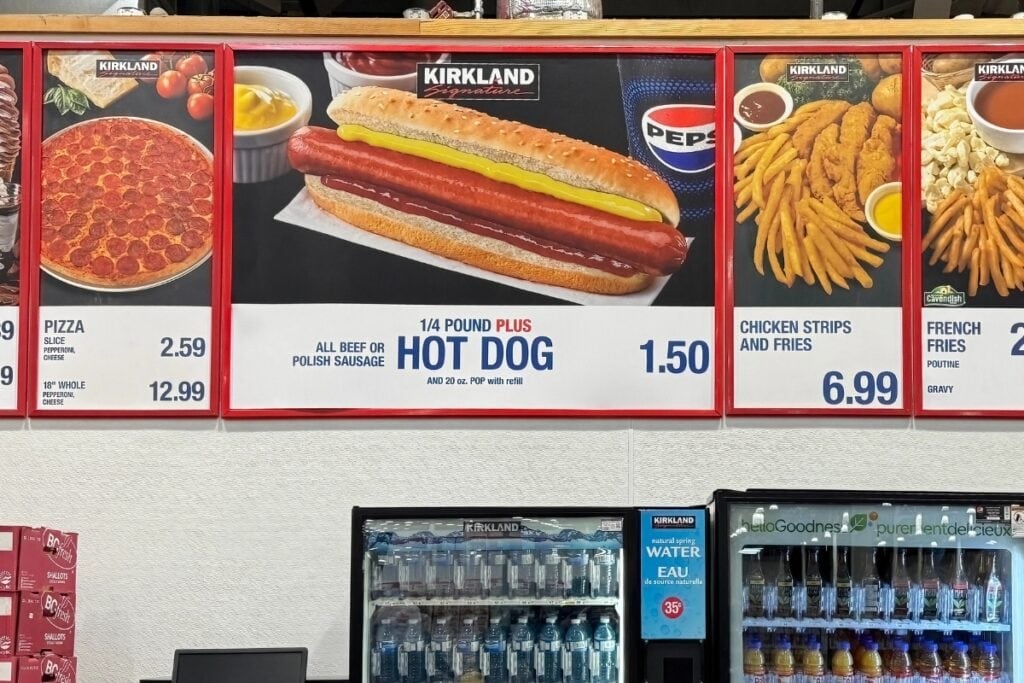 Costco food court menu board displaying hot dog combo and other items.