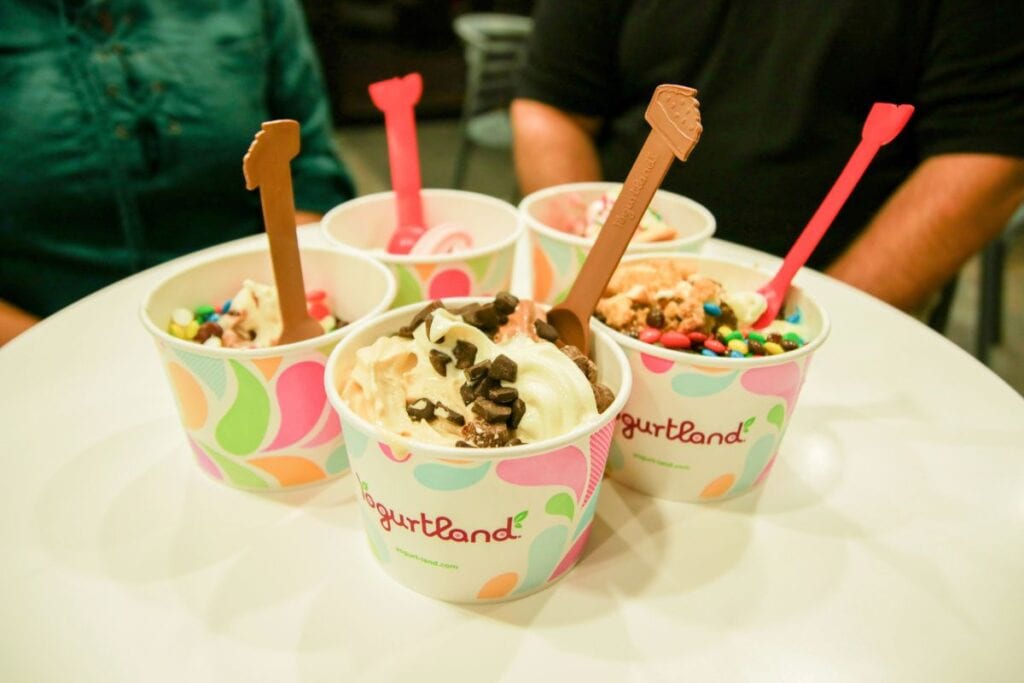Frozen yogurt with spoons.