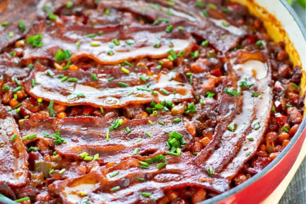 Homemade baked beans in a skillet.