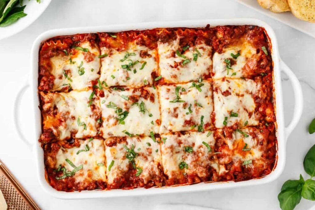 Homemade lasagna in a baking dish.