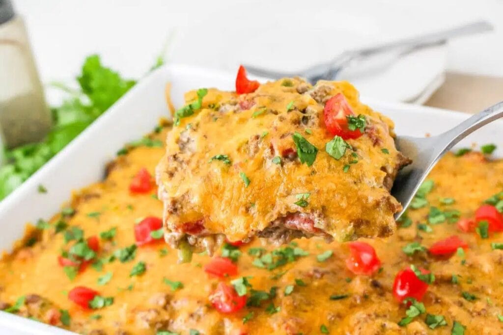 King ranch casserole with beef in a baking dish.