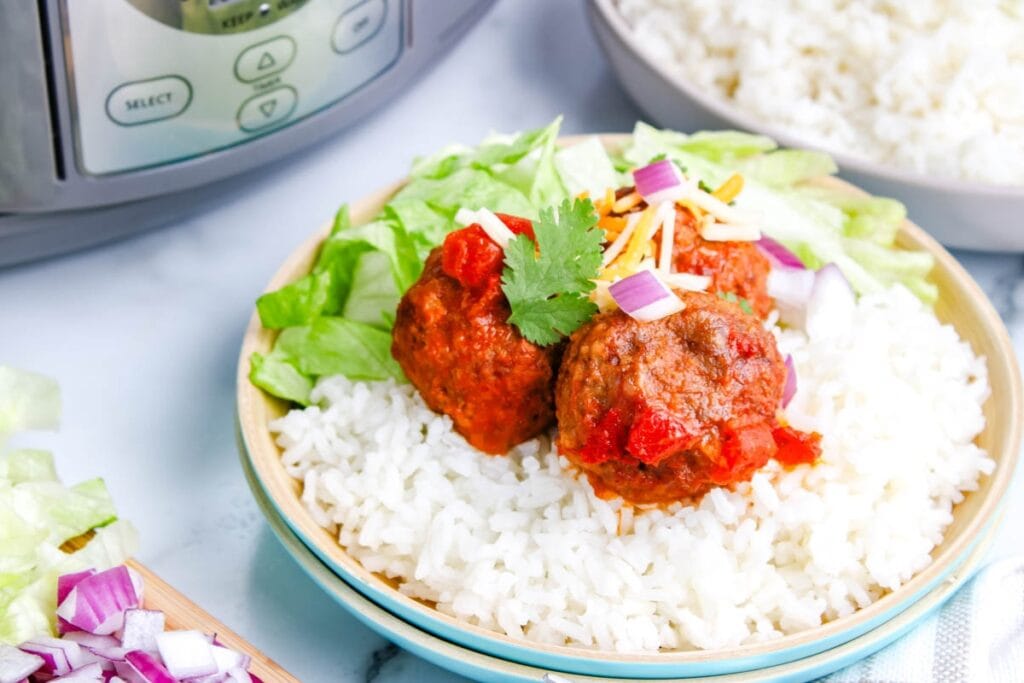 Mexican meatballs with rice on a plate.