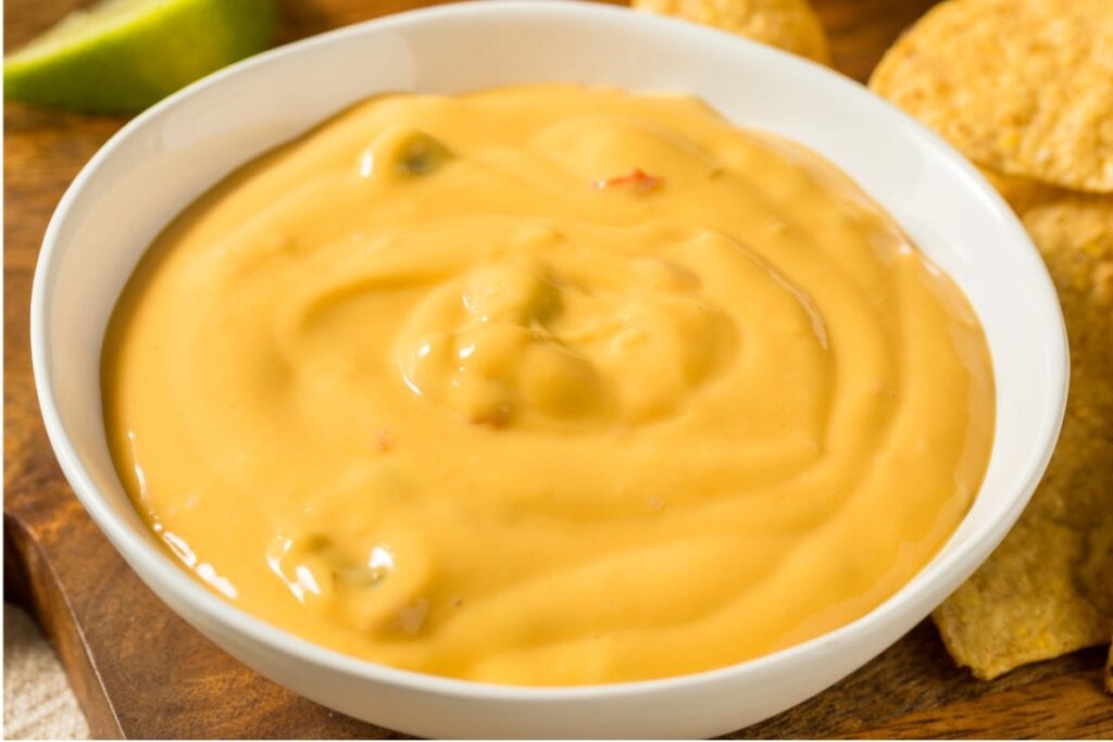 Pace Mild Nacho Cheese Sauce in a white bowl.